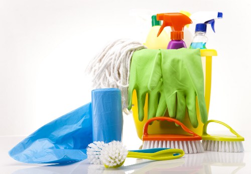 Local cleaner managing a turnover clean in an E11 apartment building