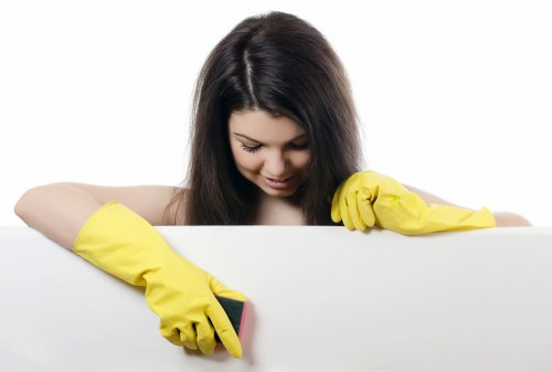 Technician cleaning a carpet in a local E11 flat with hot water extraction