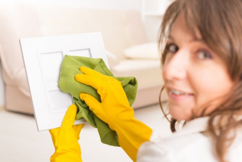 Technician assessing fabric before upholstery cleaning in E11
